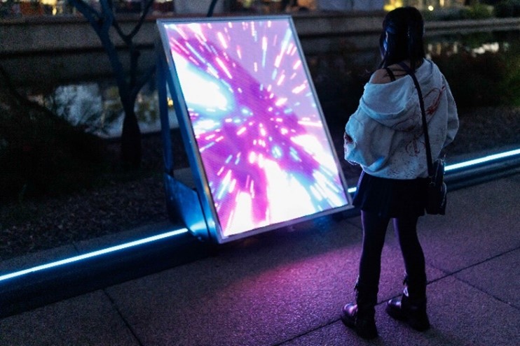 Person looking into The ARRAY installation