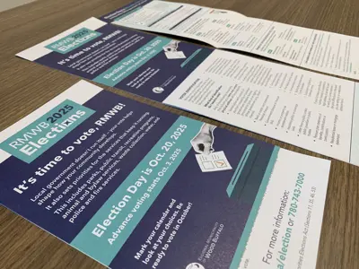 An image of the election information flyer available for pickup at Jubilee Centre, lying on a faux-wooden desk. 