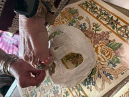 Sonia working on a mask