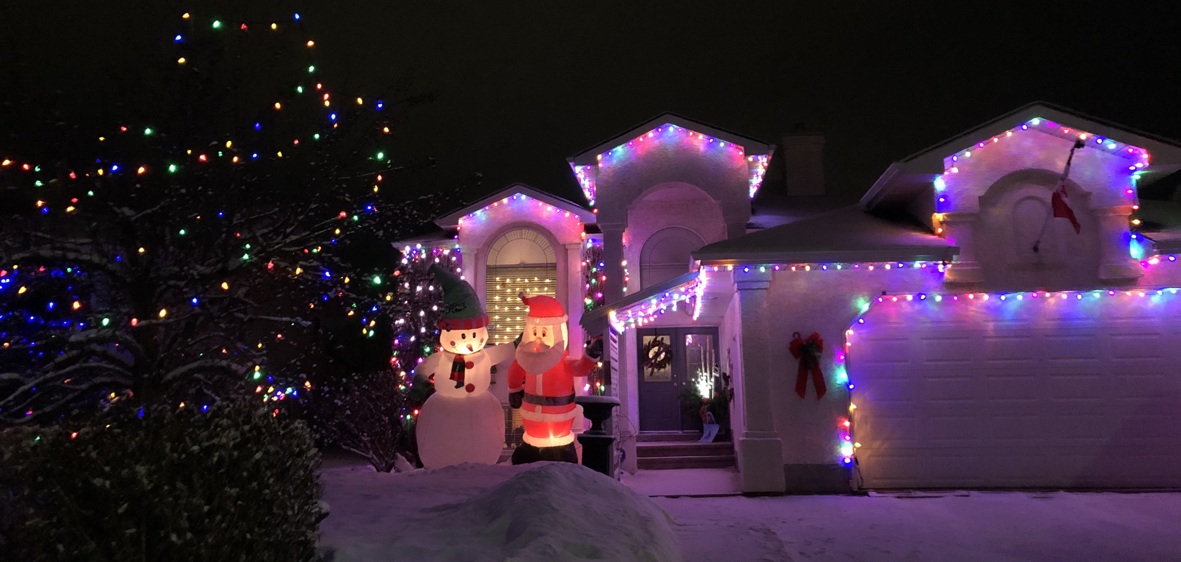 house decorated with holiday lights and decorations